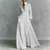 Women's maxi dress featuring long sleeves and a stylish geometric print, designed with a high-waist button-front and convenient pockets for a chic and comfortable look. 1