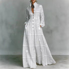 Women's maxi dress featuring long sleeves and a stylish geometric print, designed with a high-waist button-front and convenient pockets for a chic and comfortable look. 1