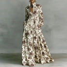 Women's maxi dress featuring long sleeves and a stylish geometric print, designed with a high-waist button-front and convenient pockets for a chic and comfortable look. 2
