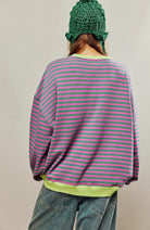 Women's oversized sweatshirt featuring neon contrast trim, striped drop-shoulder design, and made from lightweight knit fabric, perfect for casual and comfortable wear. 1