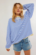 Women's oversized sweatshirt featuring neon contrast trim, striped drop-shoulder design, and made from lightweight knit fabric, perfect for casual and comfortable wear. 2