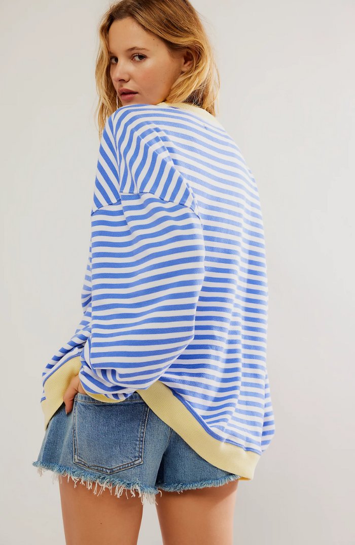 Women's oversized sweatshirt featuring neon contrast trim, striped drop-shoulder design, and made from lightweight knit fabric, perfect for casual and comfortable wear. 3