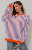 Women's oversized sweatshirt featuring neon contrast trim, striped drop-shoulder design, and made from lightweight knit fabric, perfect for casual and comfortable wear. 4