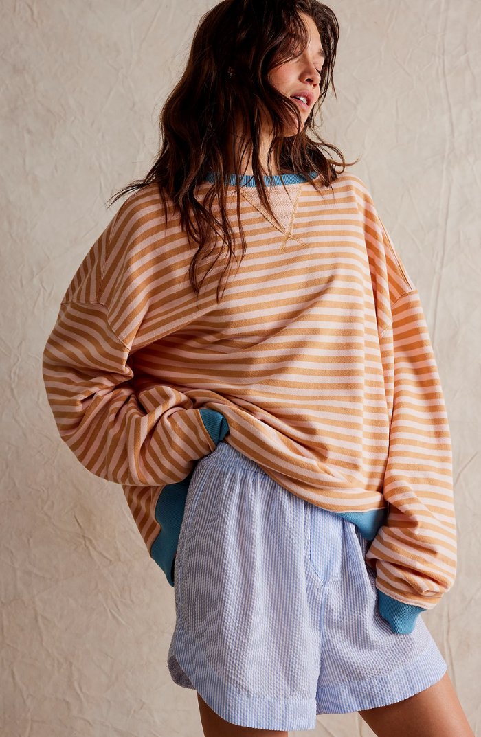 Women's oversized sweatshirt featuring neon contrast trim, striped drop-shoulder design, and made from lightweight knit fabric, perfect for casual and comfortable wear. 6