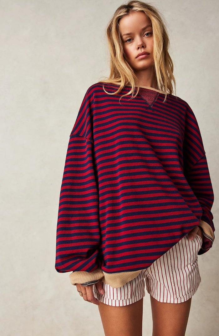 Women's oversized sweatshirt featuring neon contrast trim, striped drop-shoulder design, and made from lightweight knit fabric, perfect for casual and comfortable wear. 8