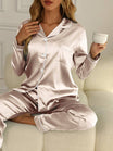 Women's Satin Pajama Set featuring a stylish button-up blouse and long trousers, perfect for a comfortable and elegant sleepwear experience. 10