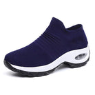 Women's slip-on sneakers featuring air cushion technology and a breathable knit design, perfect for all-day comfort and stylish casual wear. 6