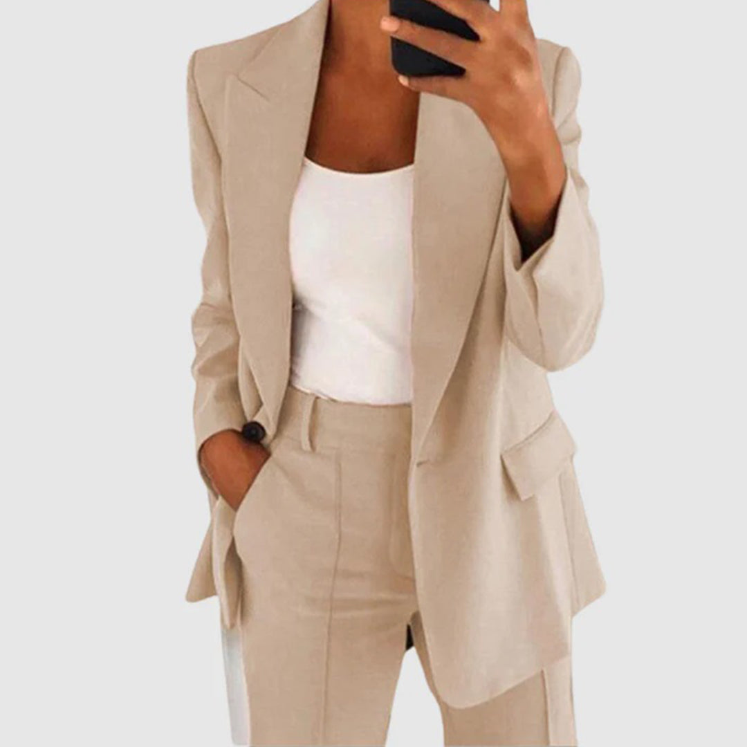 Elegant women's suit featuring a tailored blazer and high-waist trousers, perfect for office wear, showcasing a sophisticated design in a chic color palette. 1