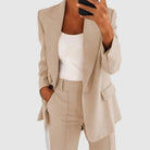 Elegant women's suit featuring a tailored blazer and high-waist trousers, perfect for office wear, showcasing a sophisticated design in a chic color palette. 1