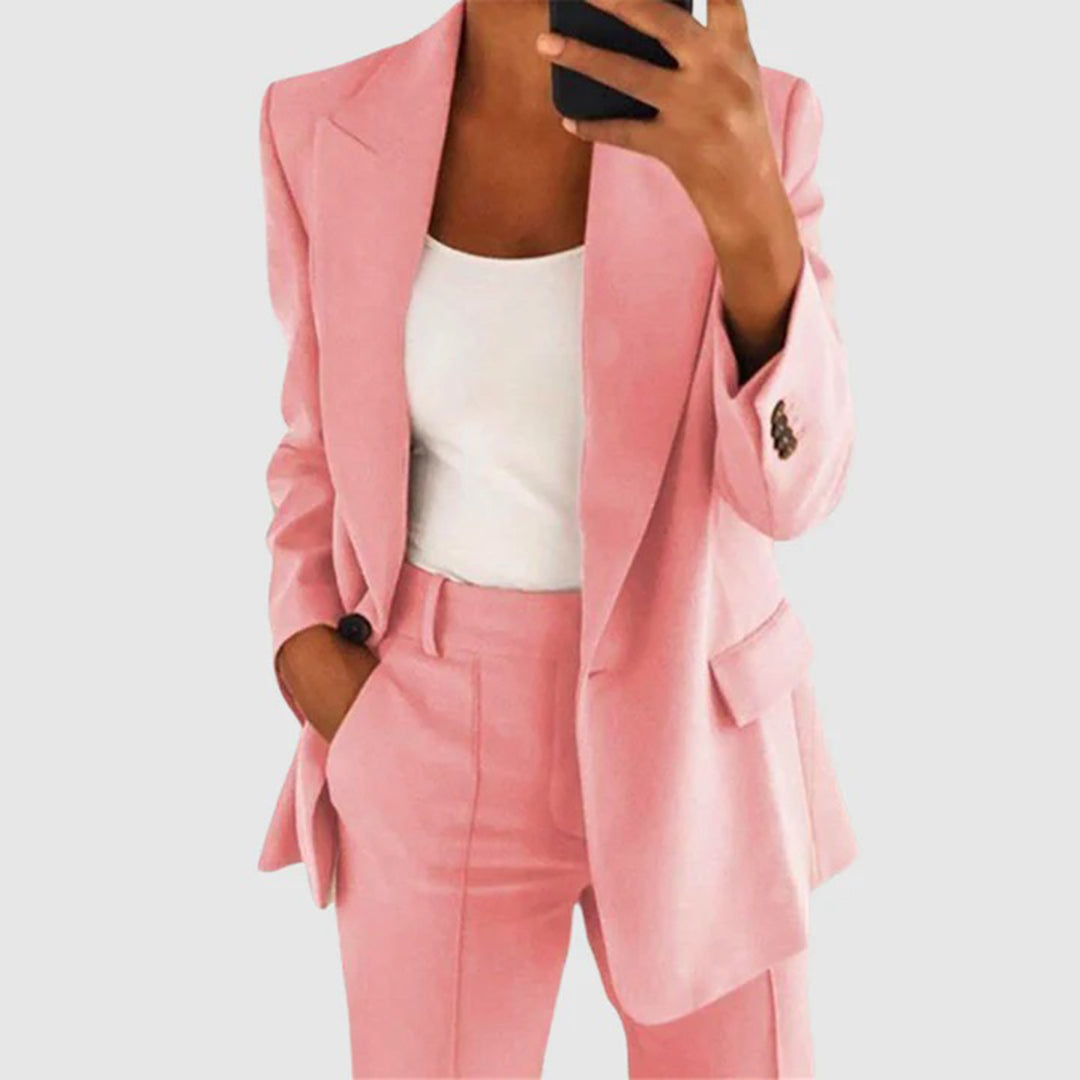 Elegant women's suit featuring a tailored blazer and high-waist trousers, perfect for office wear, showcasing a sophisticated design in a chic color palette. 2