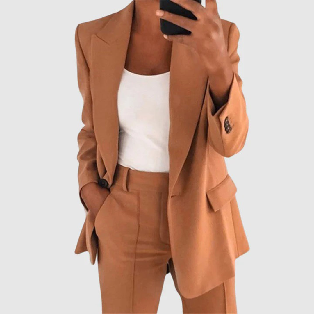 Elegant women's suit featuring a tailored blazer and high-waist trousers, perfect for office wear, showcasing a sophisticated design in a chic color palette. 3