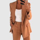 Elegant women's suit featuring a tailored blazer and high-waist trousers, perfect for office wear, showcasing a sophisticated design in a chic color palette. 3