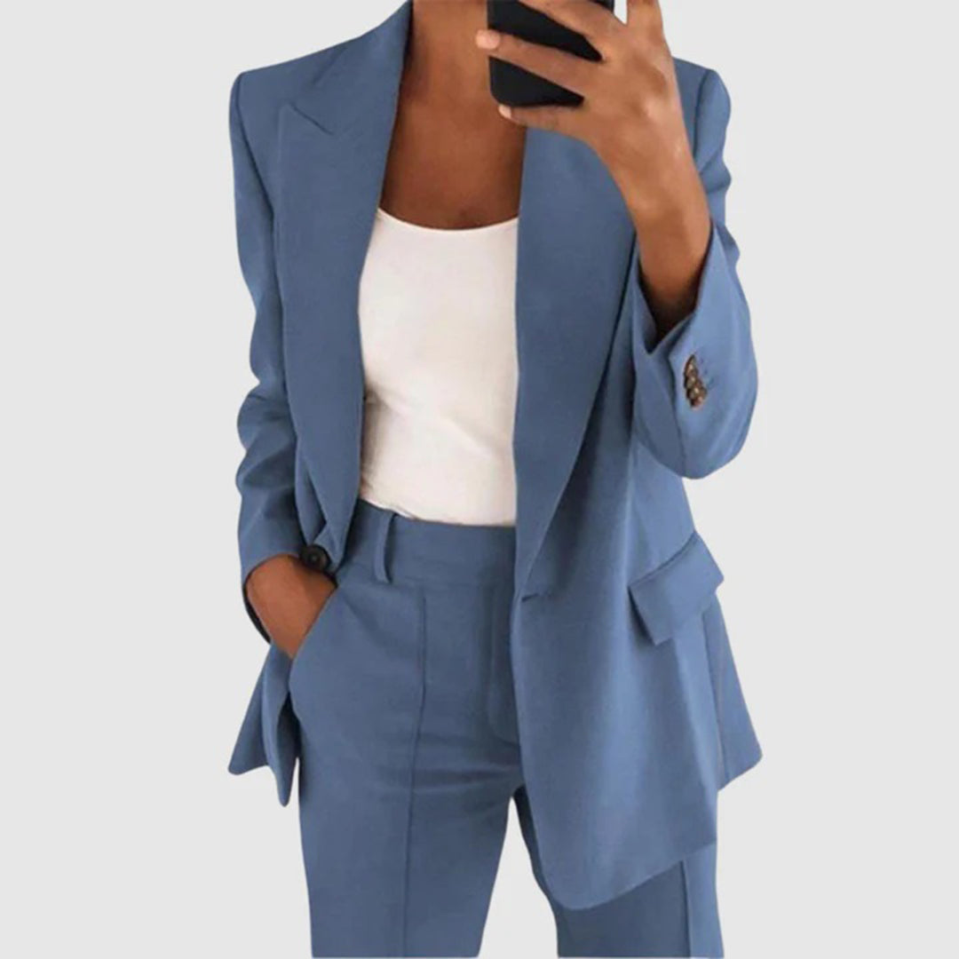 Elegant women's suit featuring a tailored blazer and high-waist trousers, perfect for office wear, showcasing a sophisticated design in a chic color palette. 4