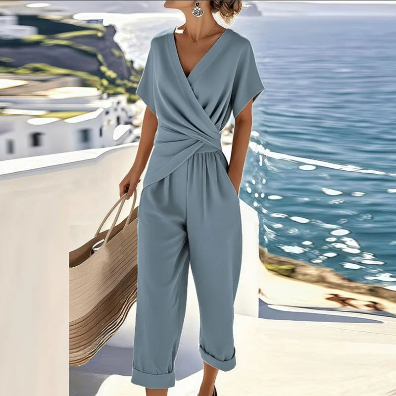 Women's V-Neck Jumpsuit featuring flattering wrap details, designed for casual summer style with short sleeves and a comfortable fit. 1