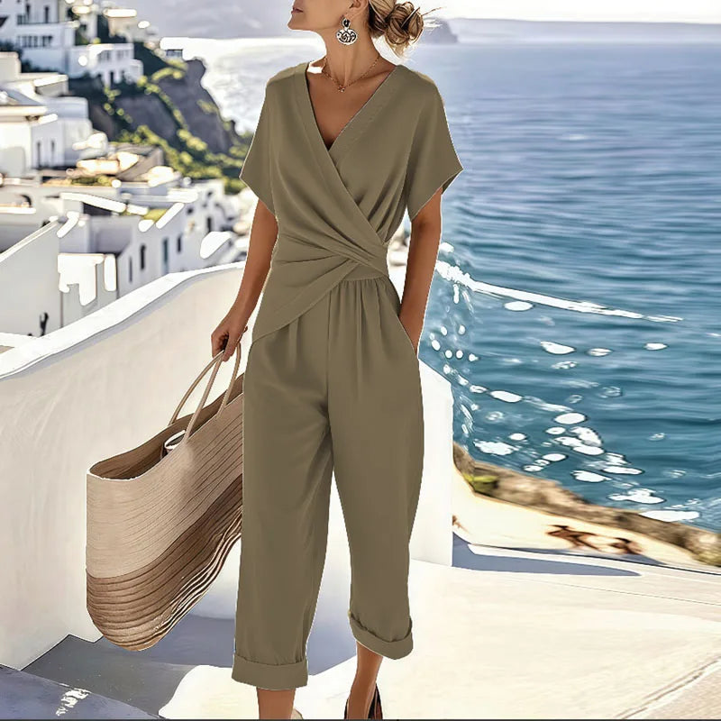 Women's V-Neck Jumpsuit featuring flattering wrap details, designed for casual summer style with short sleeves and a comfortable fit. 2