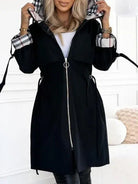 Women's waterproof trench coat featuring a hood and stylish plaid lining, designed for windproof protection and lightweight comfort in winter weather. 2