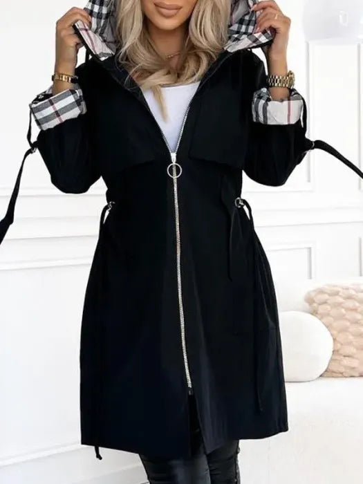 Women's waterproof trench coat featuring a hood and stylish plaid lining, designed for windproof protection and lightweight comfort in winter weather. 2
