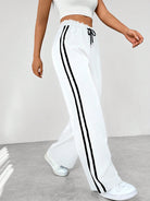 Women's wide leg trousers featuring sporty side stripes, designed for airy comfort and casual style in spring. 4