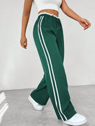 Women's wide leg trousers featuring sporty side stripes, designed for airy comfort and casual style in spring. 6