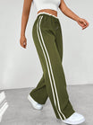 Women's wide leg trousers featuring sporty side stripes, designed for airy comfort and casual style in spring. 7