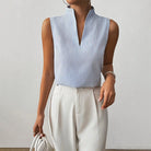 Womens blouse with stand collar and V-neck, featuring a sleeveless design and stylish striped pattern, made from a comfortable cotton blend, perfect for summer 1