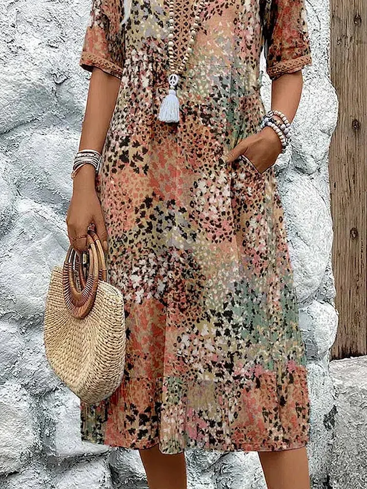 Womens summer dress featuring a V-neck design and a vibrant floral pattern, knee-length, made from soft fabric, and includes convenient side pockets. 6