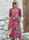 Womens summer dress featuring a V-neck design and vibrant floral pattern, knee-high length, comfortable fit, and plus sizes available for a stylish and flattering 2