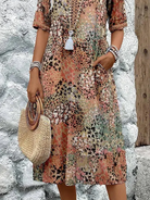 Womens summer dress featuring a V-neck design and vibrant floral pattern, knee-high length, comfortable fit, and plus sizes available for a stylish and flattering 6